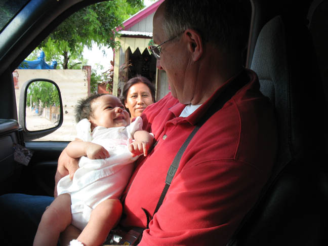 Pastor Jim with baby