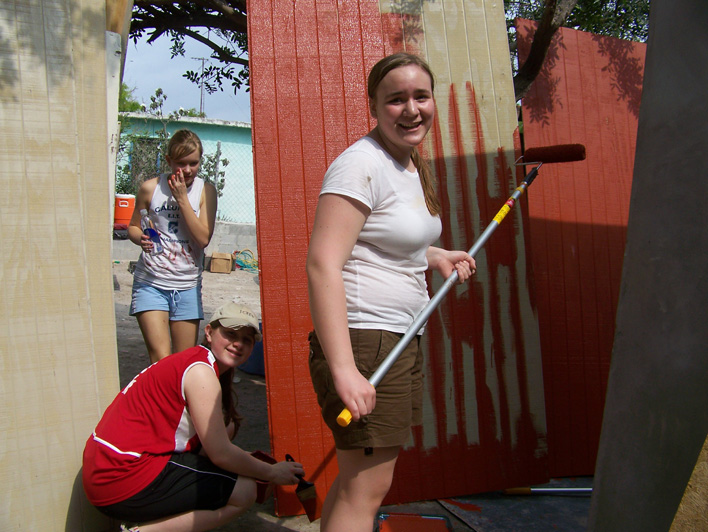 14 - Gabriela's home, painting the siding before it was put up